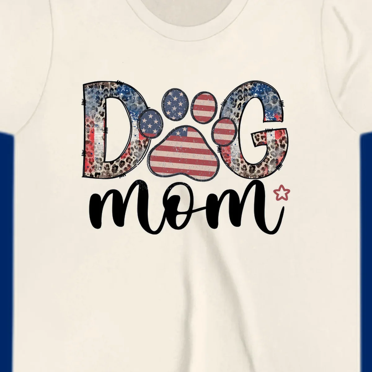 A graphic spelling 'DOG' with a patriotic-dog-paw-print. The 'D' and 'G' have leopard print and flag elements, and the 'O' is a flag paw print.