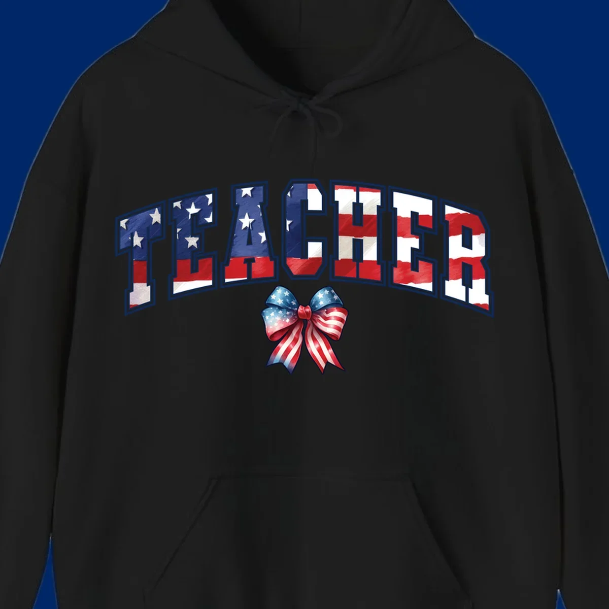 The word TEACHER in arched letters filled with an American flag pattern, featuring stars and stripes, with a patriotic bow below. Primary keyword root: patriotic-teacher-bow.