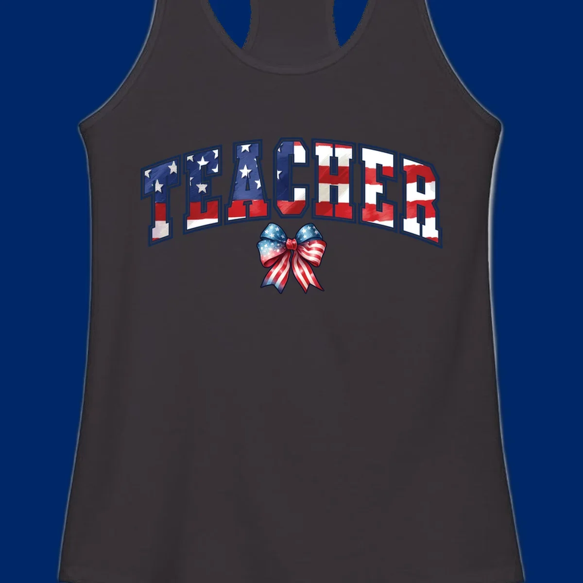 The word TEACHER in arched letters filled with an American flag pattern, featuring stars and stripes, with a patriotic bow below. Primary keyword root: patriotic-teacher-bow.