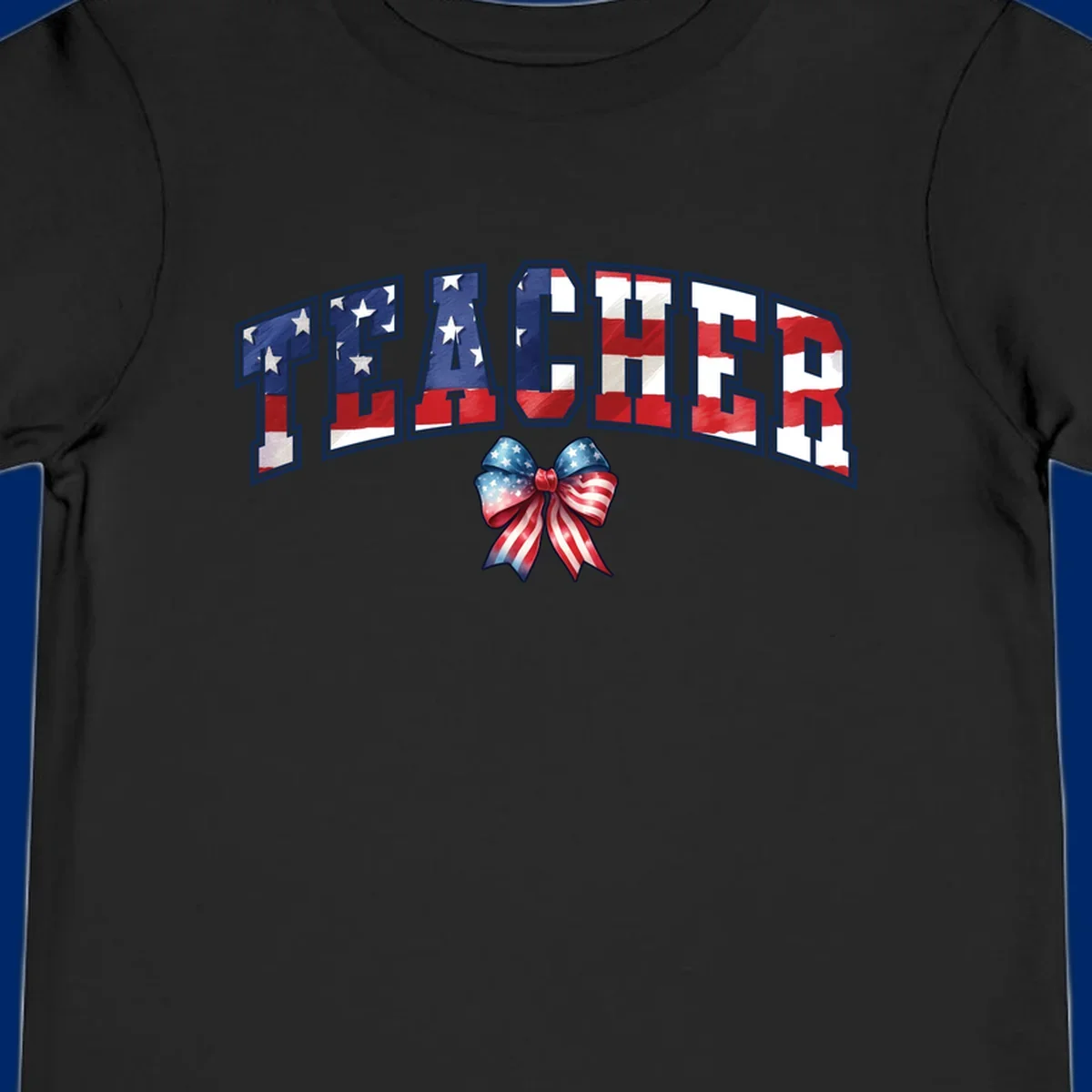 The word TEACHER in arched letters filled with an American flag pattern, featuring stars and stripes, with a patriotic bow below. Primary keyword root: patriotic-teacher-bow.