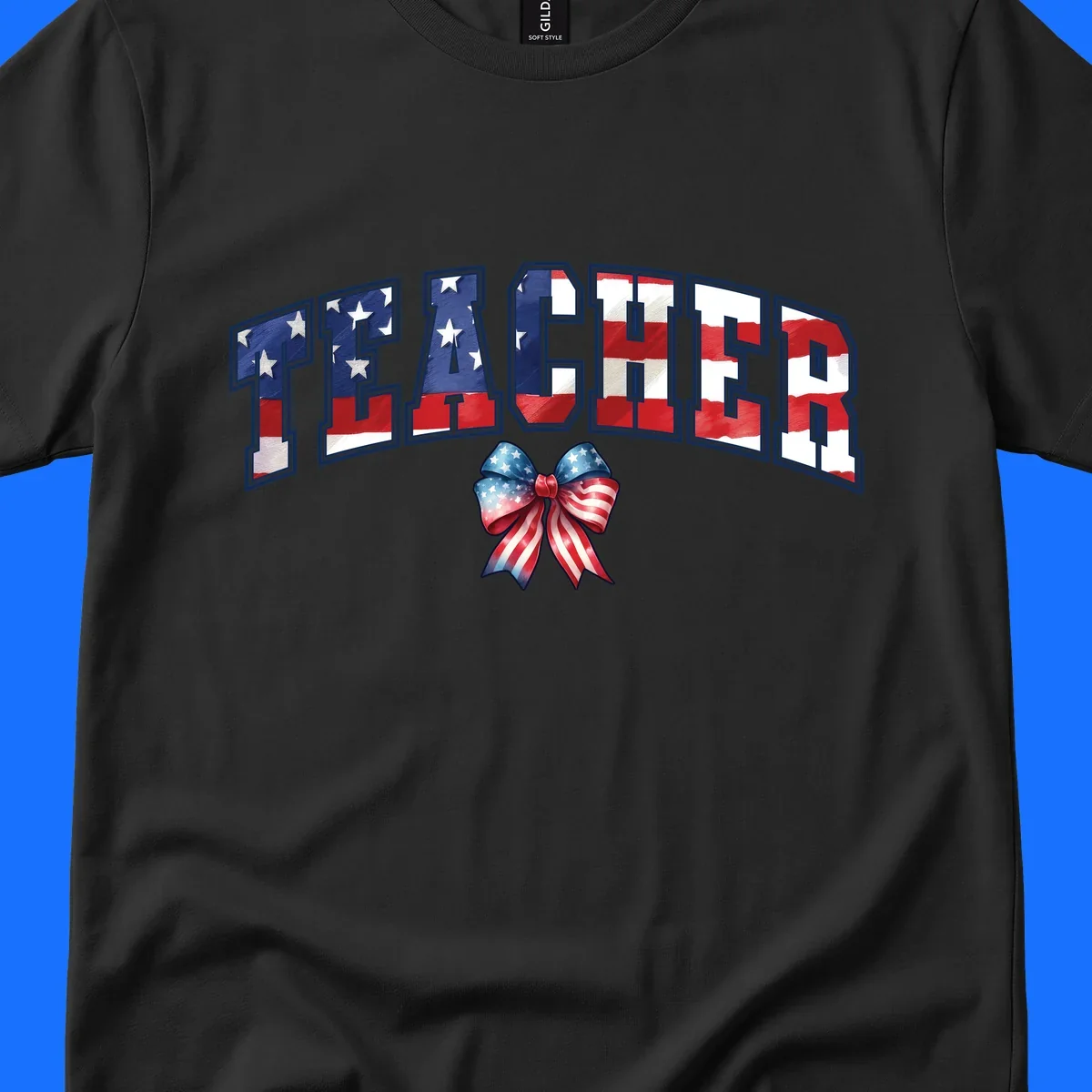 The word TEACHER in arched letters filled with an American flag pattern, featuring stars and stripes, with a patriotic bow below. Primary keyword root: patriotic-teacher-bow.