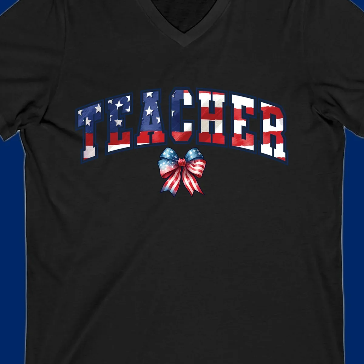 The word TEACHER in arched letters filled with an American flag pattern, featuring stars and stripes, with a patriotic bow below. Primary keyword root: patriotic-teacher-bow.