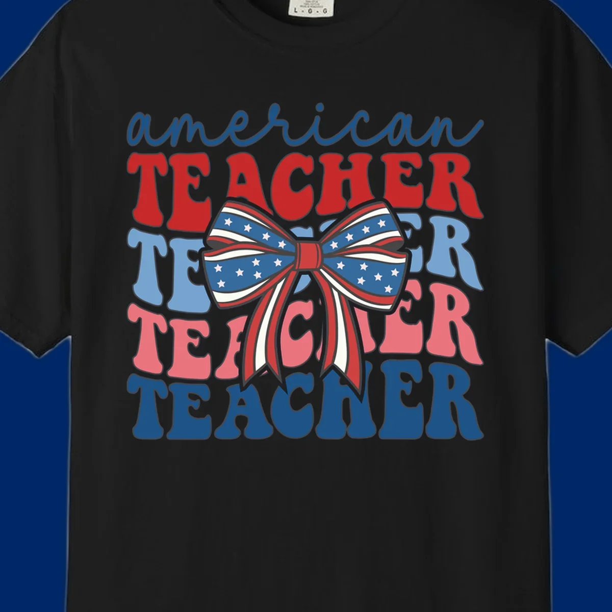 A graphic design reading 'american TEACHER' with the word TEACHER repeated four times, featuring a large patriotic American flag bow with stars and stripes. The text is in red, blue, and pink colors, outlined in dark gray.