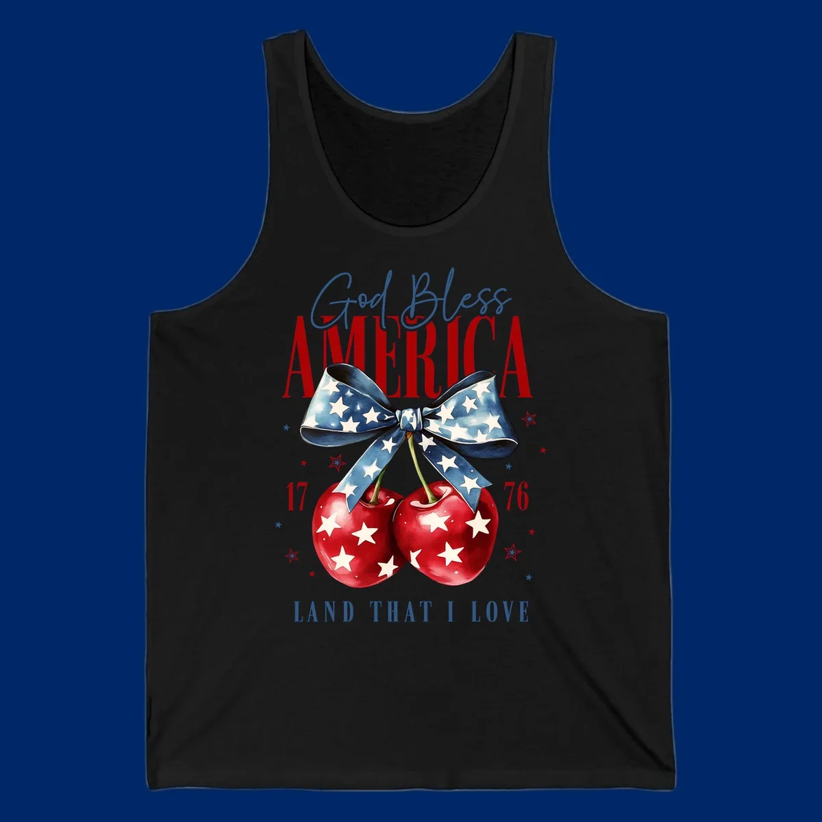 A patriotic design featuring 'God Bless AMERICA' and 'LAND THAT I LOVE' with a blue star-spangled bow, two red star-covered cherries, and the numbers '17' and '76'. god-bless-america-cherries.