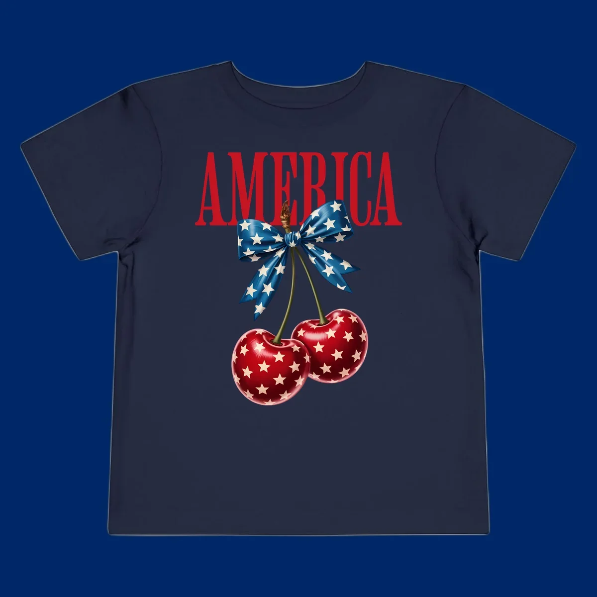 The word AMERICA in red above two red, white, and blue star-spangled cherries tied with a star bow. Features america-patriotic-cherries.