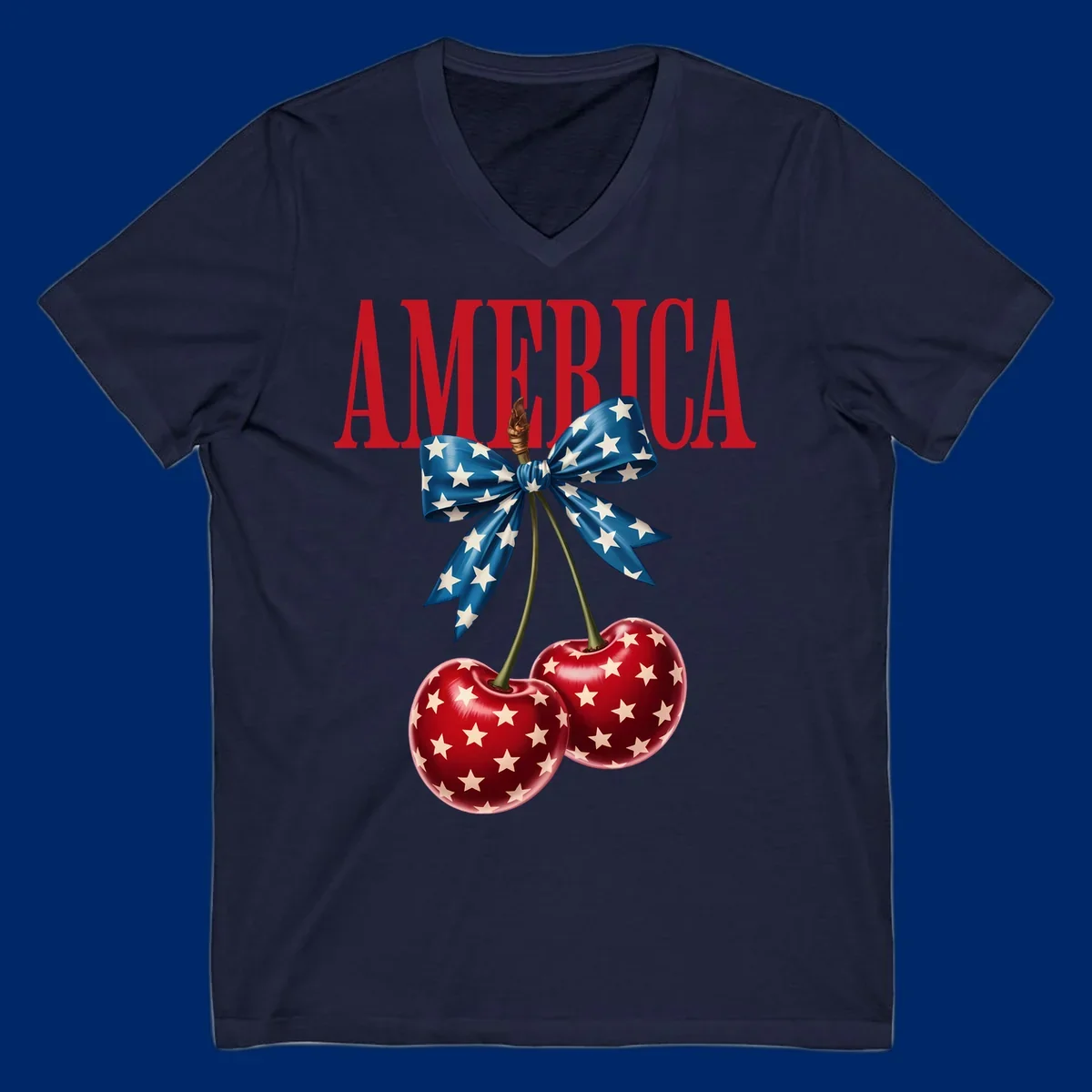 The word AMERICA in red above two red, white, and blue star-spangled cherries tied with a star bow. Features america-patriotic-cherries.