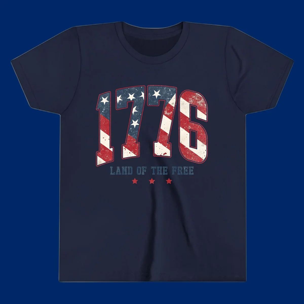 Vintage distressed design featuring the number 1776 in American flag colors and 'LAND OF THE FREE' text, celebrating America's history.