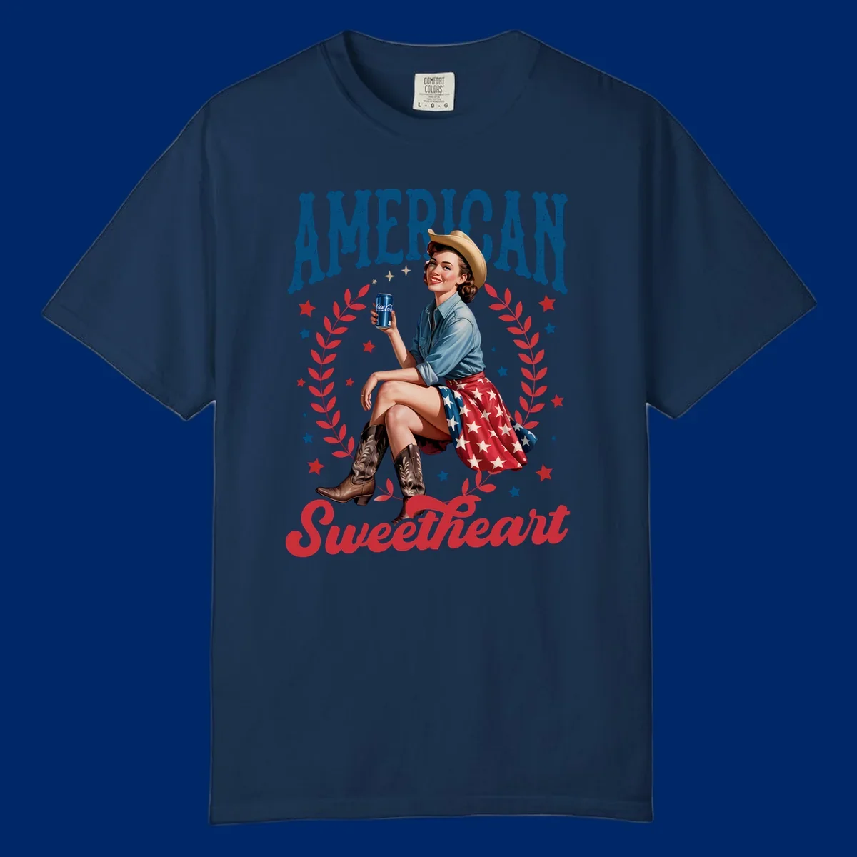 A vintage American sweetheart pin-up girl wearing a cowboy hat and American flag skirt, holding a Coca-Cola can, framed by leaves and stars, with 'AMERICAN Sweetheart' text. This american-sweetheart-pin-up design is perfect for celebrating.