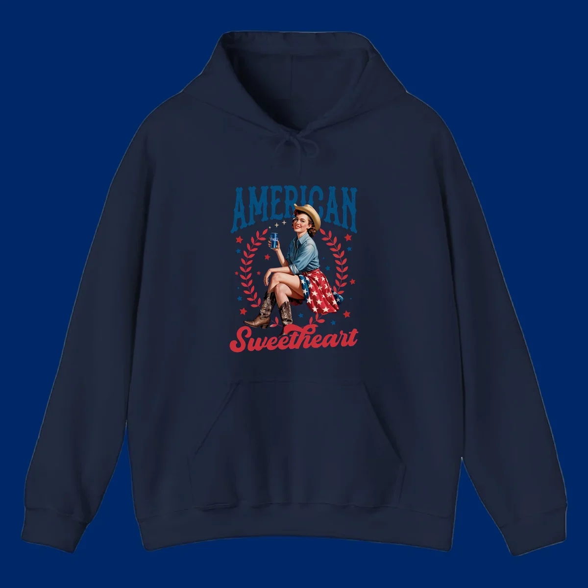 A vintage American sweetheart pin-up girl wearing a cowboy hat and American flag skirt, holding a Coca-Cola can, framed by leaves and stars, with 'AMERICAN Sweetheart' text. This american-sweetheart-pin-up design is perfect for celebrating.