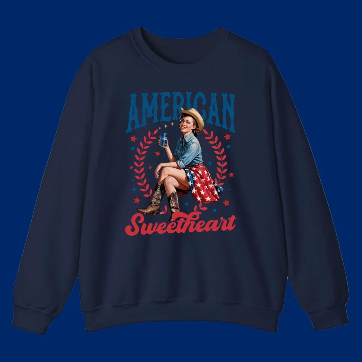 A vintage American sweetheart pin-up girl wearing a cowboy hat and American flag skirt, holding a Coca-Cola can, framed by leaves and stars, with 'AMERICAN Sweetheart' text. This american-sweetheart-pin-up design is perfect for celebrating.