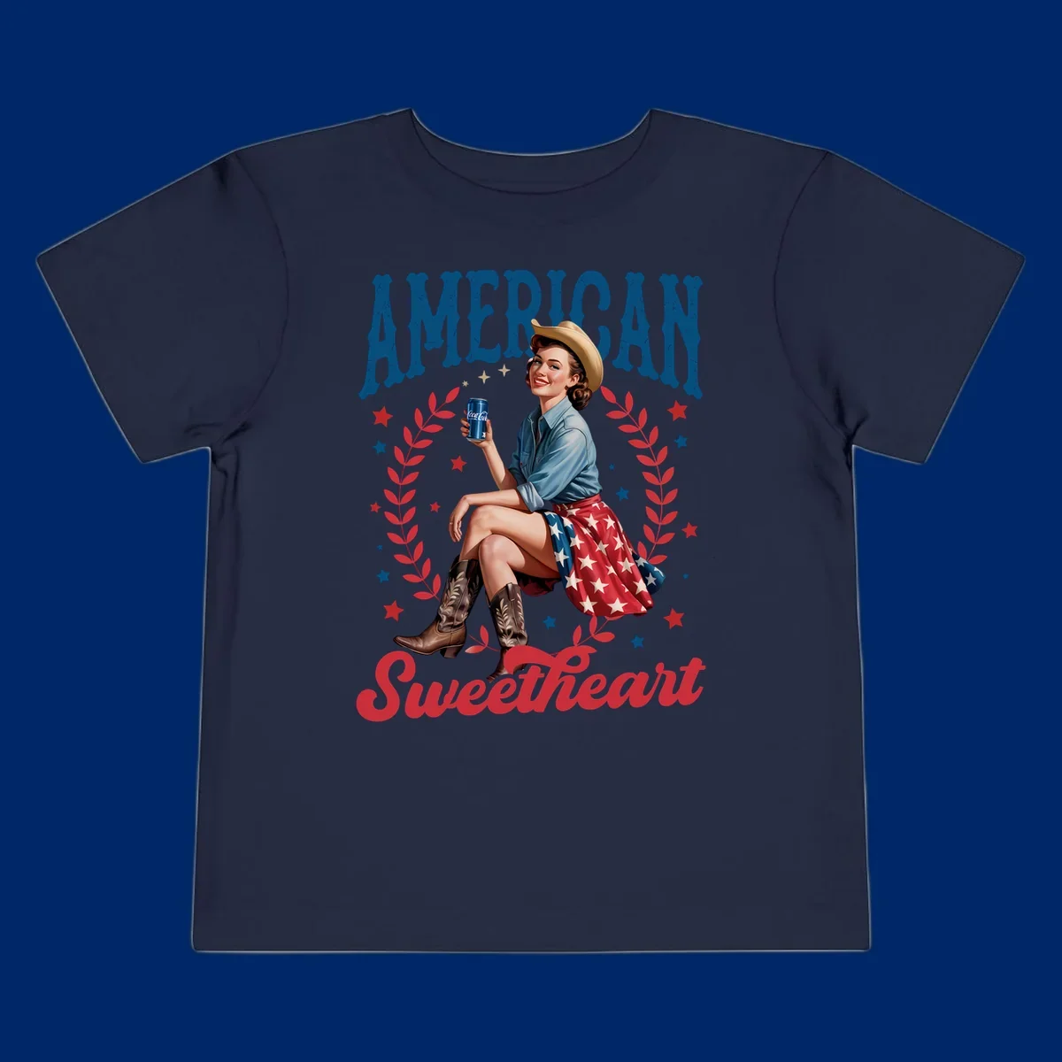 A vintage American sweetheart pin-up girl wearing a cowboy hat and American flag skirt, holding a Coca-Cola can, framed by leaves and stars, with 'AMERICAN Sweetheart' text. This american-sweetheart-pin-up design is perfect for celebrating.