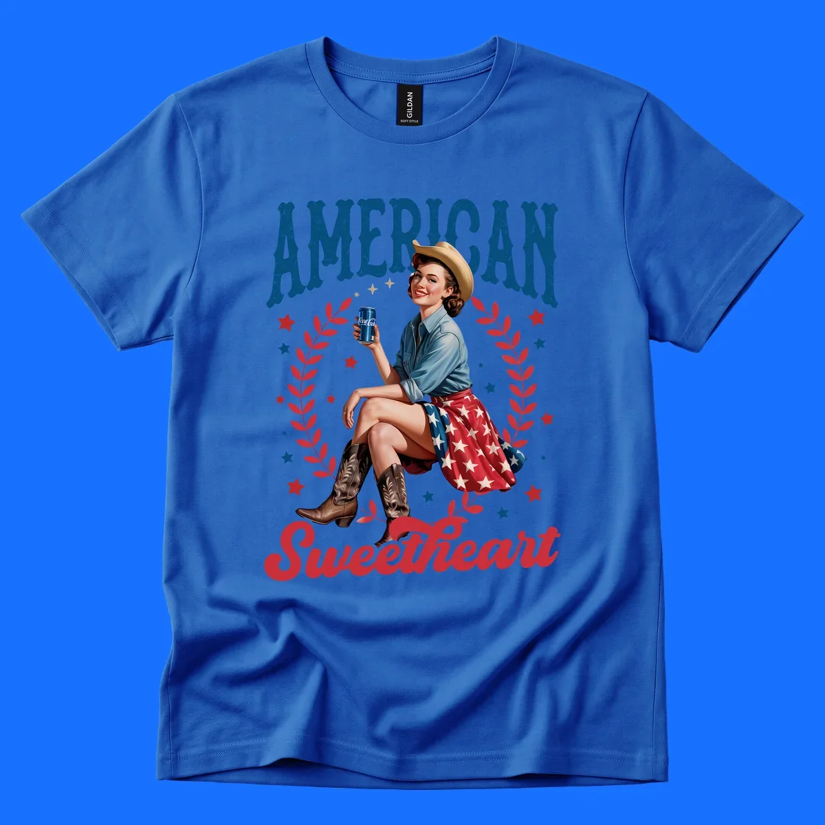 A vintage American sweetheart pin-up girl wearing a cowboy hat and American flag skirt, holding a Coca-Cola can, framed by leaves and stars, with 'AMERICAN Sweetheart' text. This american-sweetheart-pin-up design is perfect for celebrating.