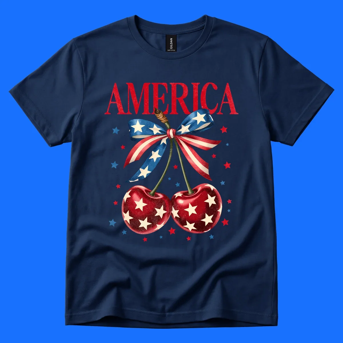 Vintage patriotic artwork featuring red 'AMERICA' text, two red cherries with white stars, and an American flag ribbon. Scattered red and blue stars complete this America-cherries-stars design.