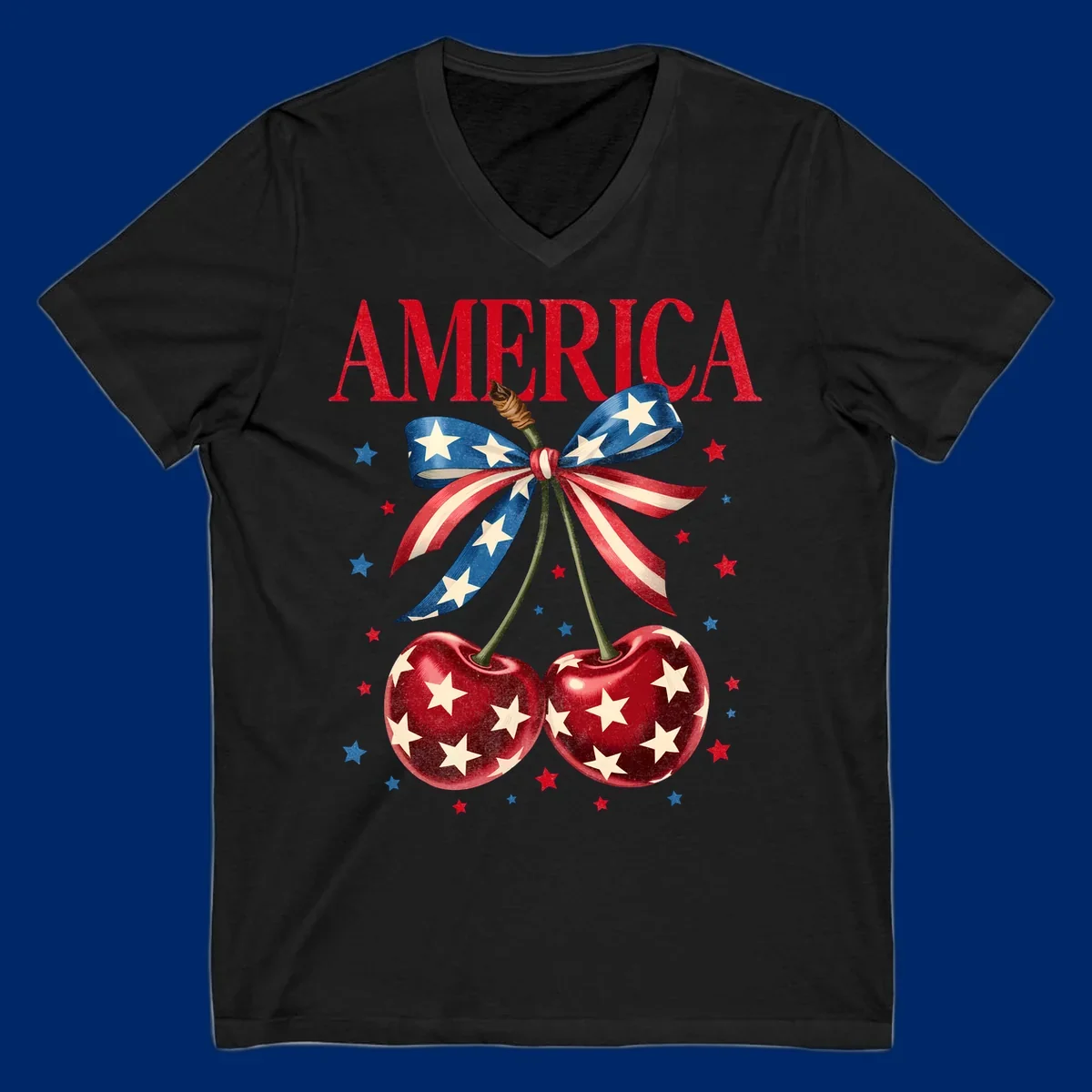 Vintage patriotic artwork featuring red 'AMERICA' text, two red cherries with white stars, and an American flag ribbon. Scattered red and blue stars complete this America-cherries-stars design.