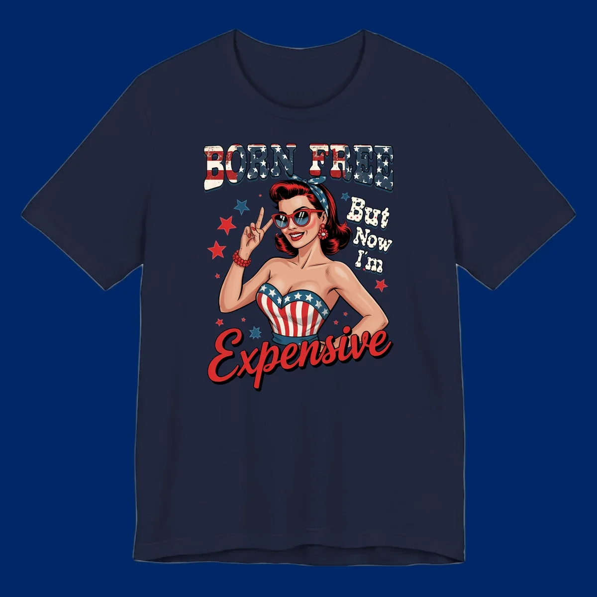 Retro pin-up girl making a peace sign, wearing a stars and stripes top, with the text 'BORN FREE But Now I'm Expensive'. This born-free-expensive-pin-up design is patriotic and fun.