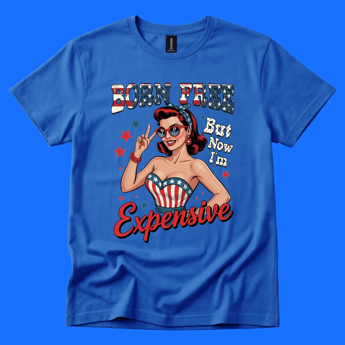 Retro pin-up girl making a peace sign, wearing a stars and stripes top, with the text 'BORN FREE But Now I'm Expensive'. This born-free-expensive-pin-up design is patriotic and fun.