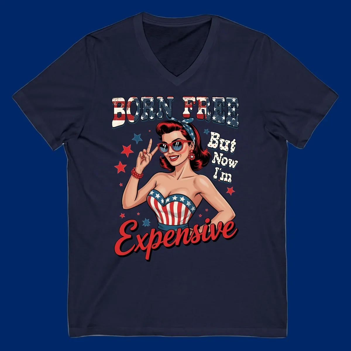 Retro pin-up girl making a peace sign, wearing a stars and stripes top, with the text 'BORN FREE But Now I'm Expensive'. This born-free-expensive-pin-up design is patriotic and fun.