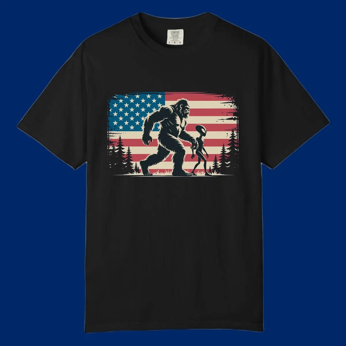 A vintage illustration of Bigfoot and a grey alien walking through a forest, set against a distressed bigfoot-alien-american-flag.