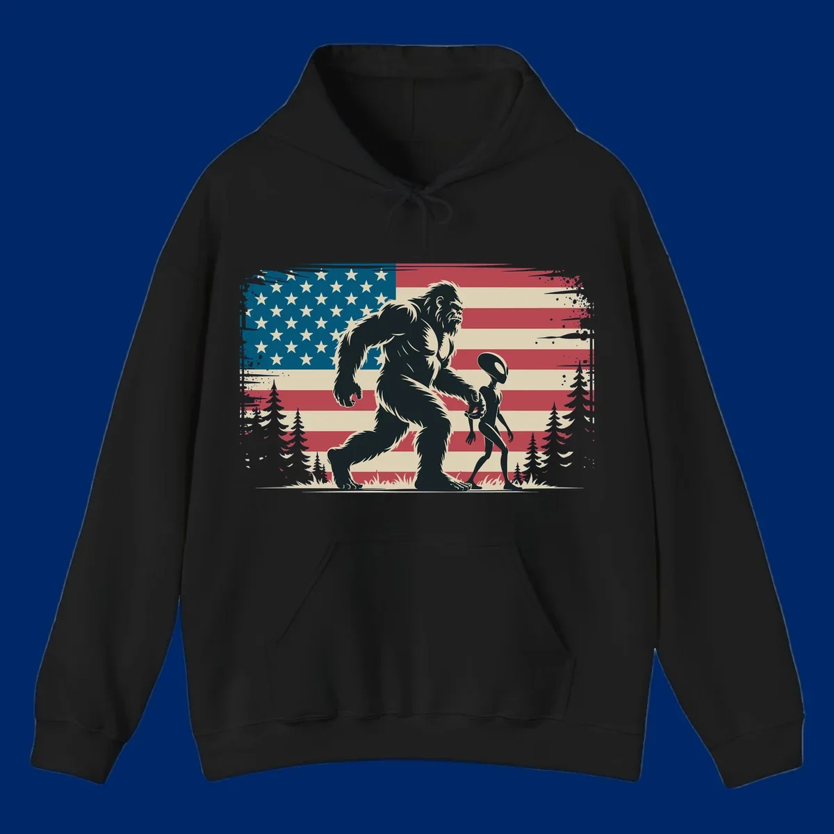 A vintage illustration of Bigfoot and a grey alien walking through a forest, set against a distressed bigfoot-alien-american-flag.