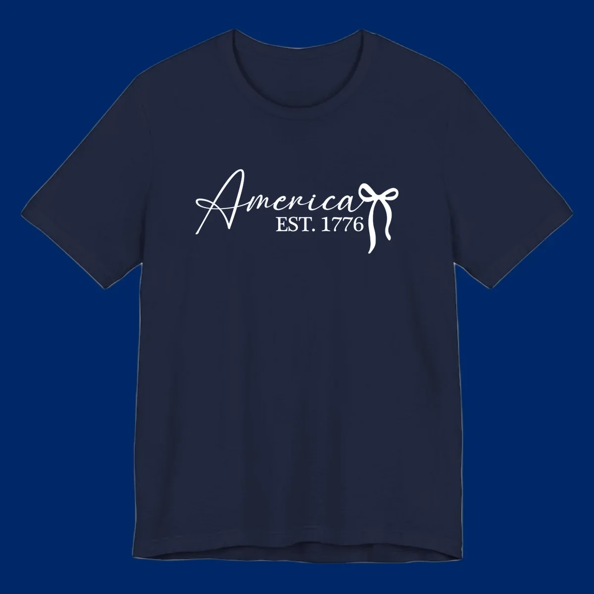 White script text "America" with decorative flourishes above "EST. 1776" in serif font, on a black background. Design for america-est-1776.