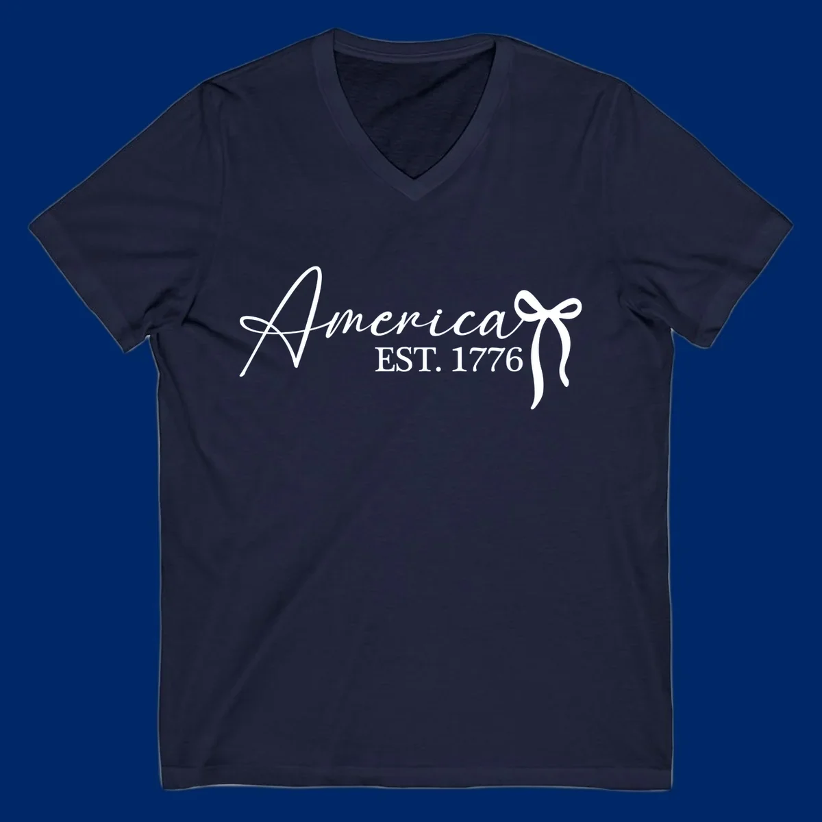 White script text "America" with decorative flourishes above "EST. 1776" in serif font, on a black background. Design for america-est-1776.