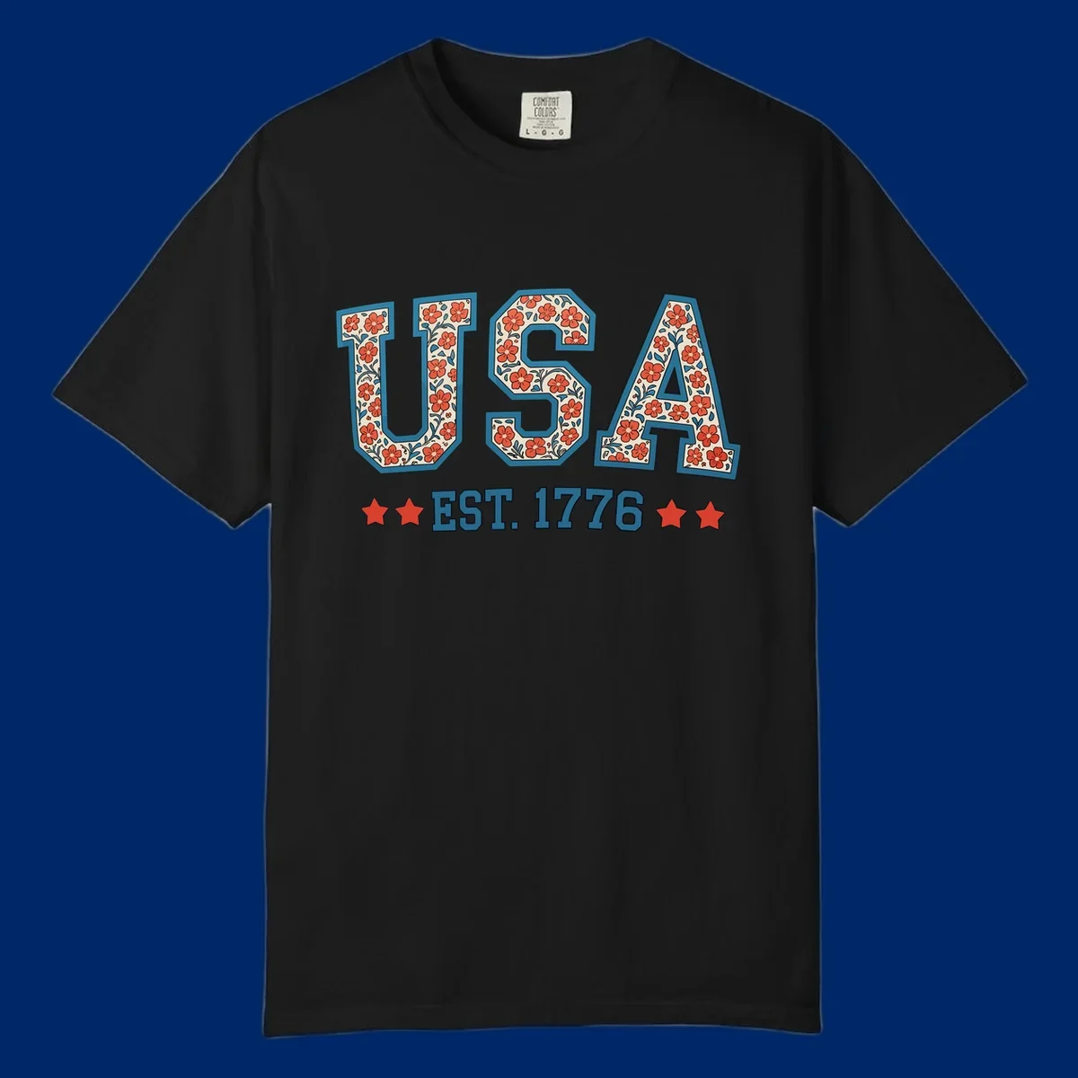 Illustrated text 'USA' with red flowers and blue leaves, above blue 'EST. 1776' text flanked by red stars. Concept: usa-est-1776-floral.