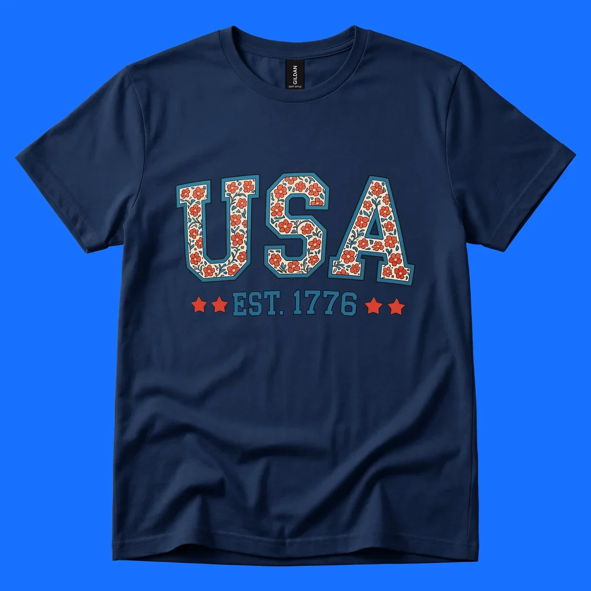 Illustrated text 'USA' with red flowers and blue leaves, above blue 'EST. 1776' text flanked by red stars. Concept: usa-est-1776-floral.