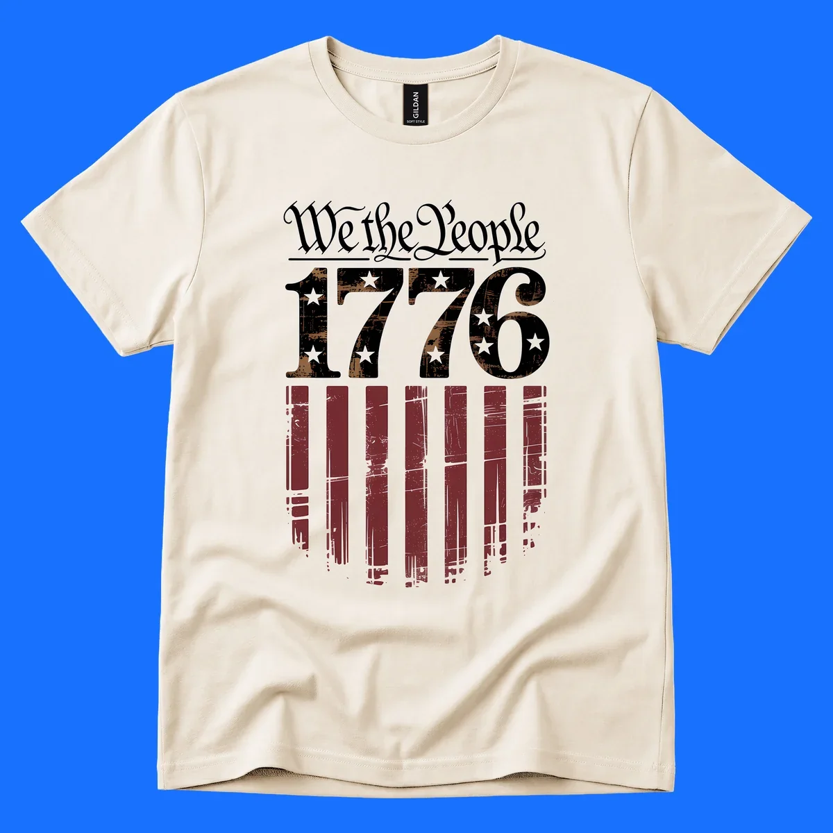 A distressed patriotic design featuring 'We the People' in script, '1776' with stars, and red stripes below, embodying the we-the-people-1776-flag theme.