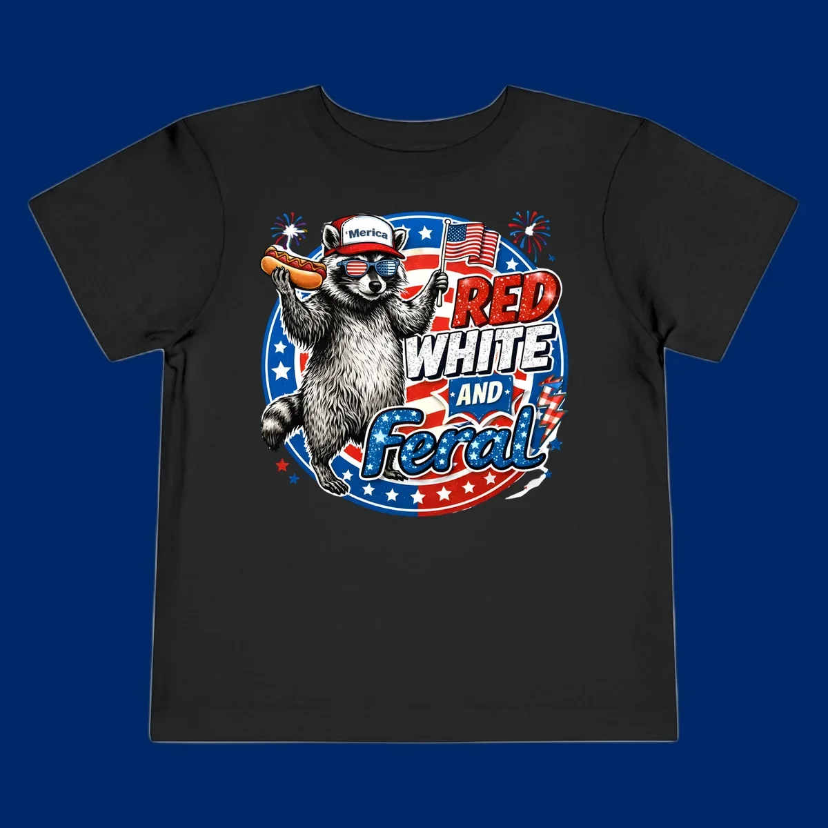A patriotic-raccoon-feral illustration of a raccoon in a 'Merica hat, flag sunglasses, holding a hotdog and US flag. Text: RED WHITE AND Feral.