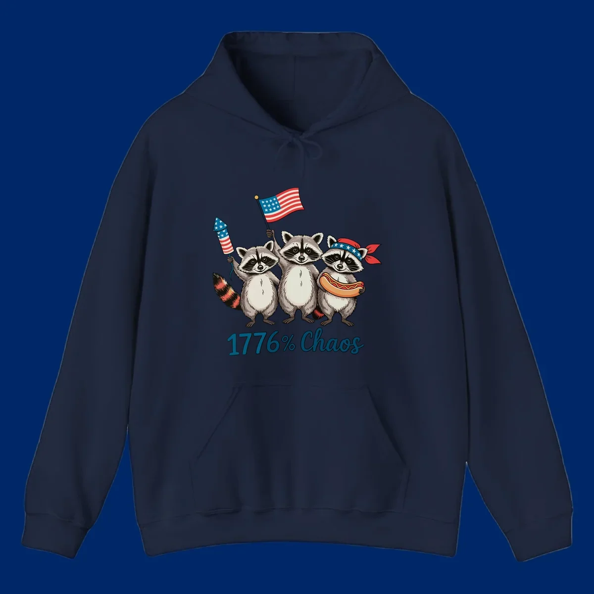 Illustration of three patriotic raccoons celebrating with an American flag, firework, and hot dog, with '1776% Chaos' text. Represents 1776-chaos-raccoons-celebration.