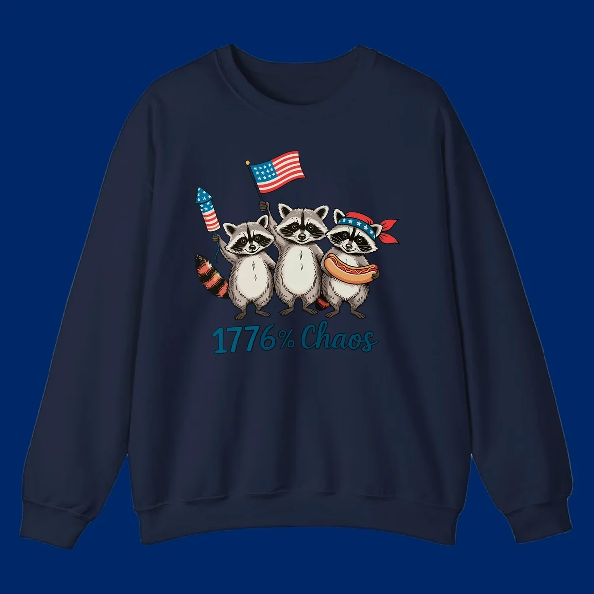 Illustration of three patriotic raccoons celebrating with an American flag, firework, and hot dog, with '1776% Chaos' text. Represents 1776-chaos-raccoons-celebration.
