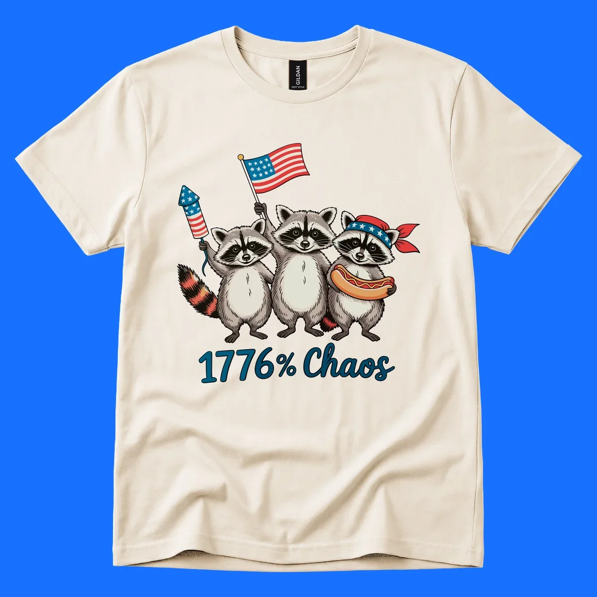 Illustration of three patriotic raccoons celebrating with an American flag, firework, and hot dog, with '1776% Chaos' text. Represents 1776-chaos-raccoons-celebration.