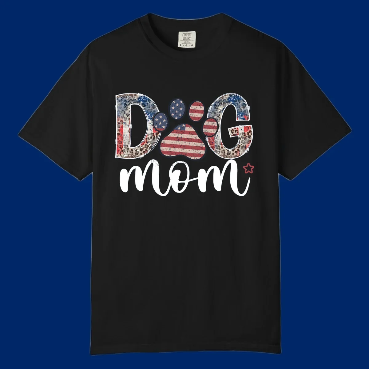 A graphic spelling 'DOG' with a patriotic-dog-paw-print. The 'D' and 'G' have leopard print and flag elements, and the 'O' is a flag paw print.