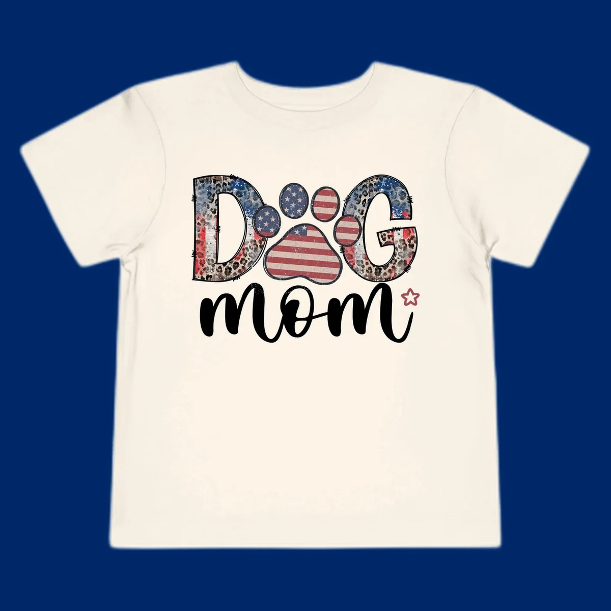 A graphic spelling 'DOG' with a patriotic-dog-paw-print. The 'D' and 'G' have leopard print and flag elements, and the 'O' is a flag paw print.