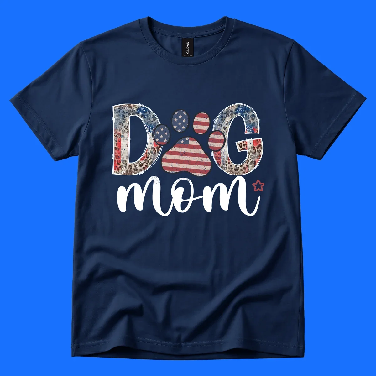 A graphic spelling 'DOG' with a patriotic-dog-paw-print. The 'D' and 'G' have leopard print and flag elements, and the 'O' is a flag paw print.
