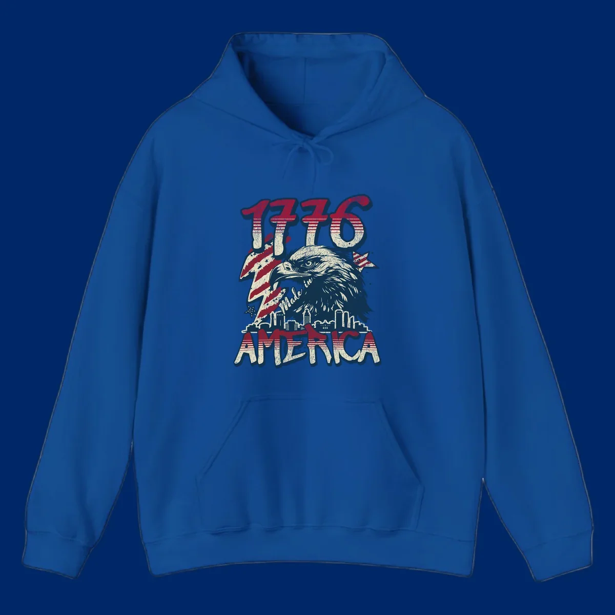 Vintage 1776 Made in America design with a bald eagle, city skyline, and American flag pattern. Features distressed red, cream, and navy colors.