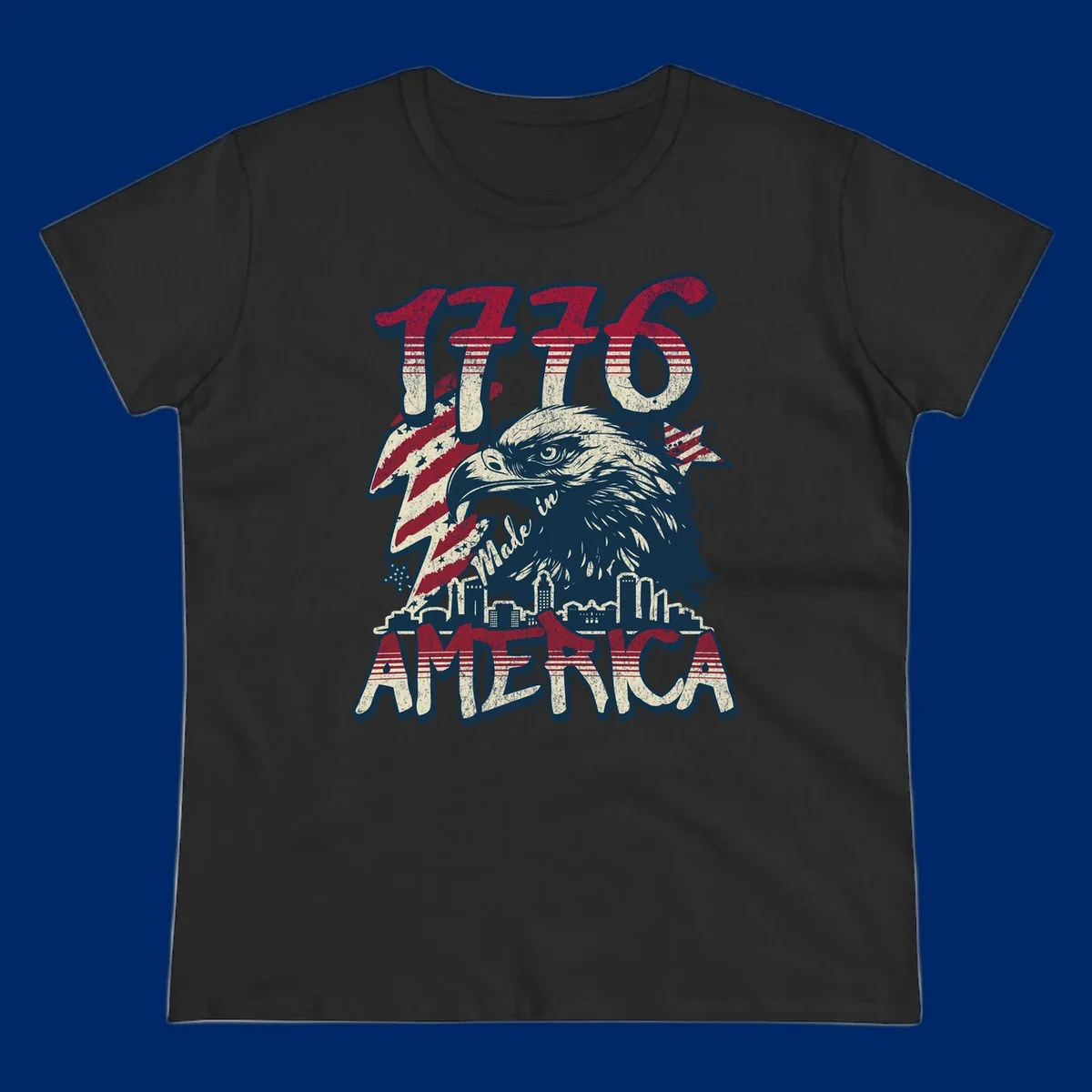 Vintage 1776 Made in America design with a bald eagle, city skyline, and American flag pattern. Features distressed red, cream, and navy colors.