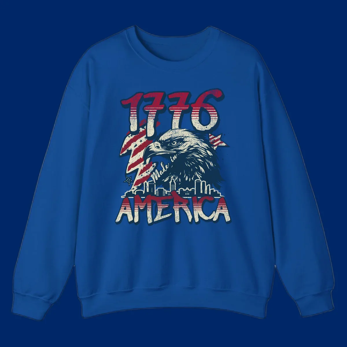 Vintage 1776 Made in America design with a bald eagle, city skyline, and American flag pattern. Features distressed red, cream, and navy colors.