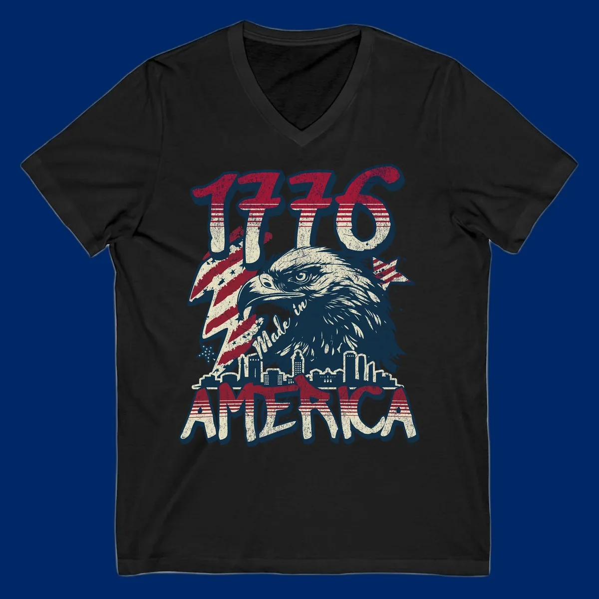 Vintage 1776 Made in America design with a bald eagle, city skyline, and American flag pattern. Features distressed red, cream, and navy colors.