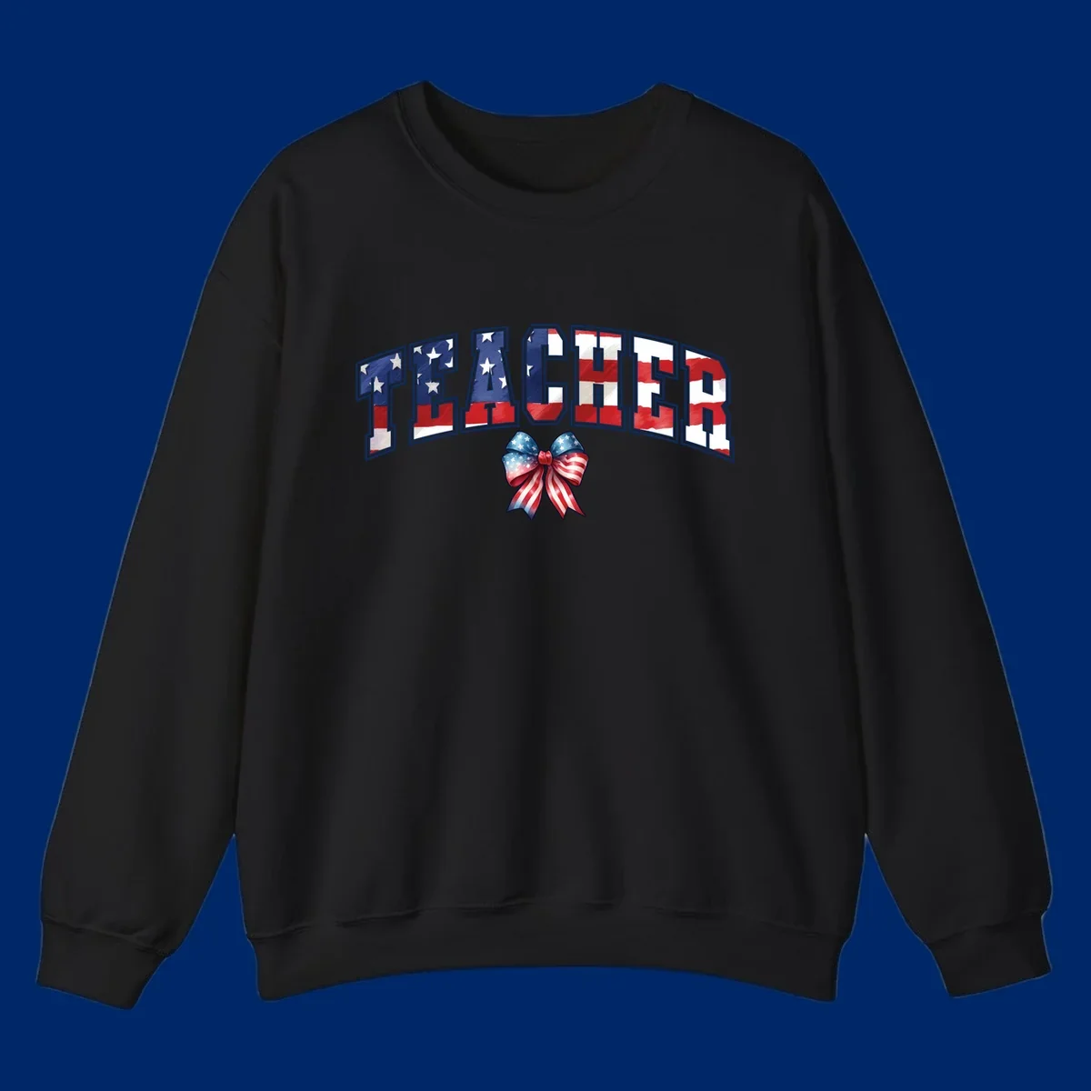 The word TEACHER in arched letters filled with an American flag pattern, featuring stars and stripes, with a patriotic bow below. Primary keyword root: patriotic-teacher-bow.