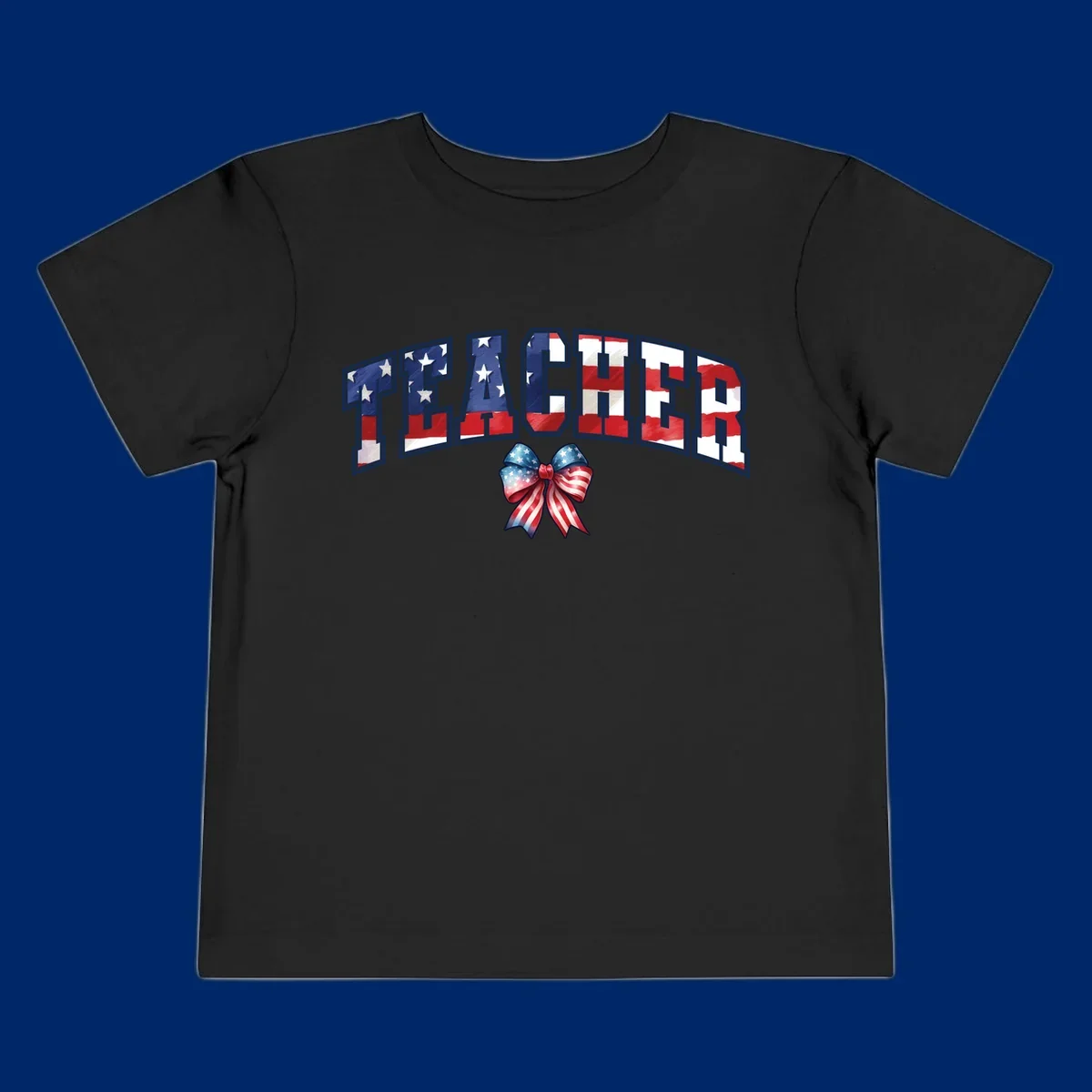 The word TEACHER in arched letters filled with an American flag pattern, featuring stars and stripes, with a patriotic bow below. Primary keyword root: patriotic-teacher-bow.