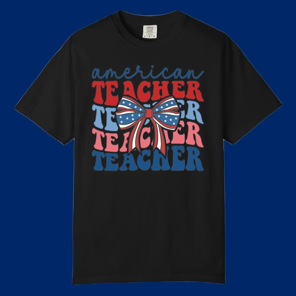 A graphic design reading 'american TEACHER' with the word TEACHER repeated four times, featuring a large patriotic American flag bow with stars and stripes. The text is in red, blue, and pink colors, outlined in dark gray.