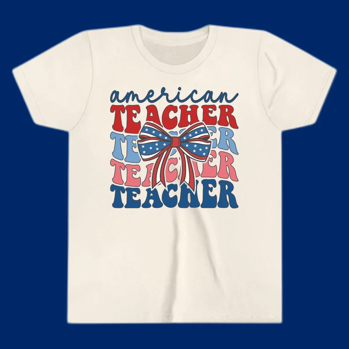 A graphic design reading 'american TEACHER' with the word TEACHER repeated four times, featuring a large patriotic American flag bow with stars and stripes. The text is in red, blue, and pink colors, outlined in dark gray.