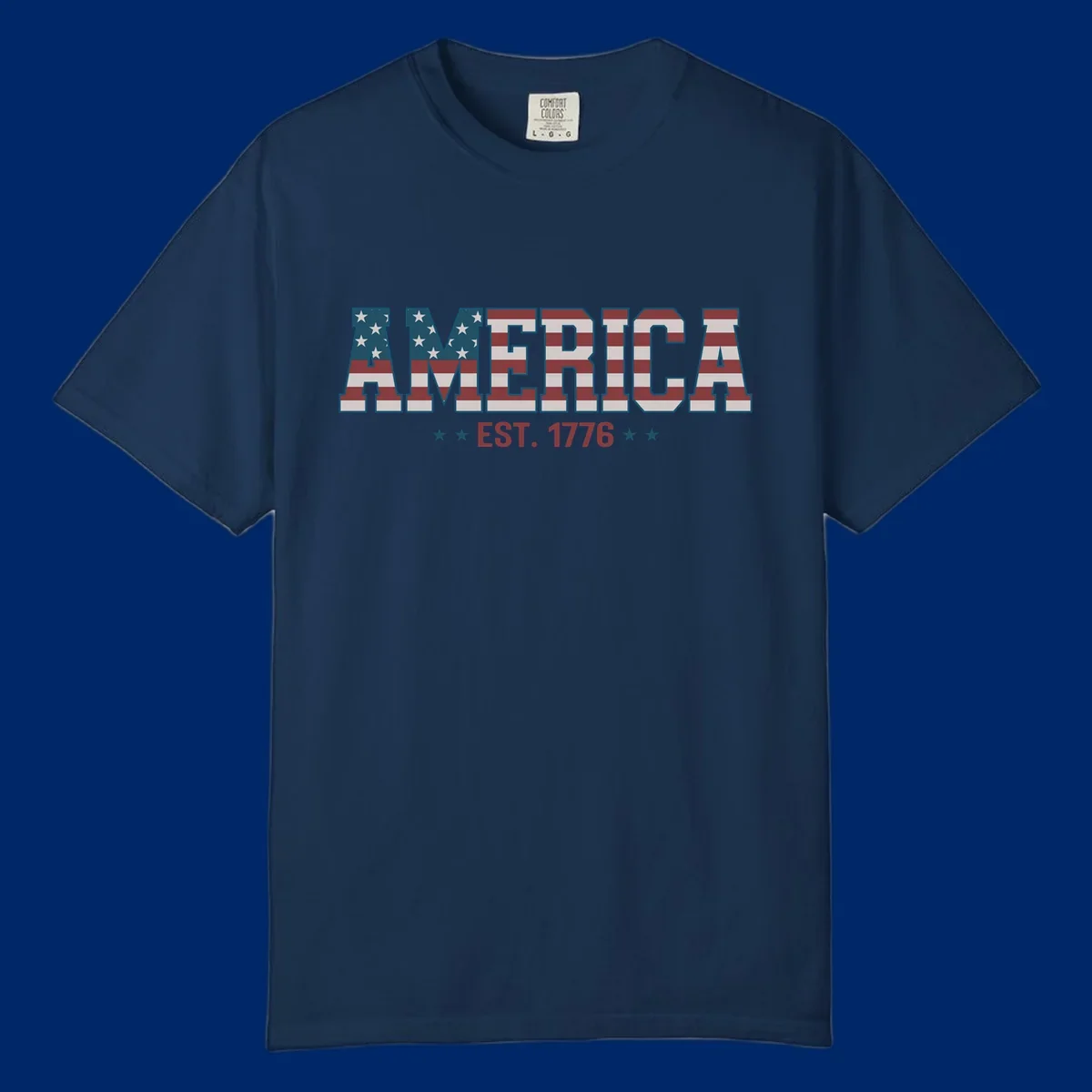 The word AMERICA in large block letters filled with a distressed American flag pattern, with EST. 1776 below flanked by stars, representing america-established-1776.