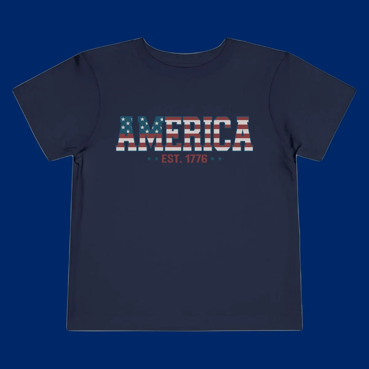 The word AMERICA in large block letters filled with a distressed American flag pattern, with EST. 1776 below flanked by stars, representing america-established-1776.