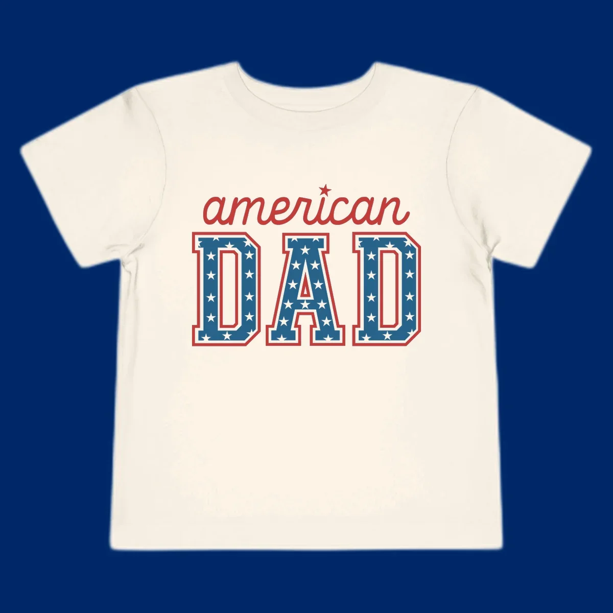 A patriotic design reading 'american DAD'. 'american' is red script with a star. 'DAD' is blue with white stars and a red outline, representing american-dad-patriotic-stars.