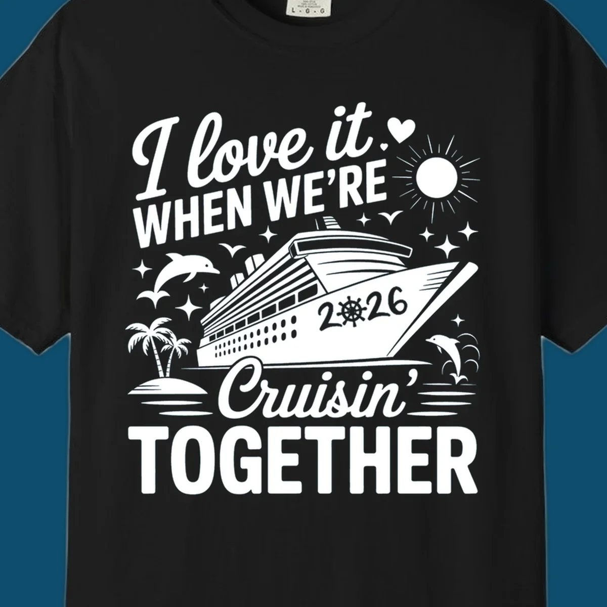 A white and dark blue cruise ship design with "I love it WHEN WE'RE Cruisin' TOGETHER" and "2026", showing dolphins and palm trees, symbolizing a love-cruisin-together-2026 vacation.