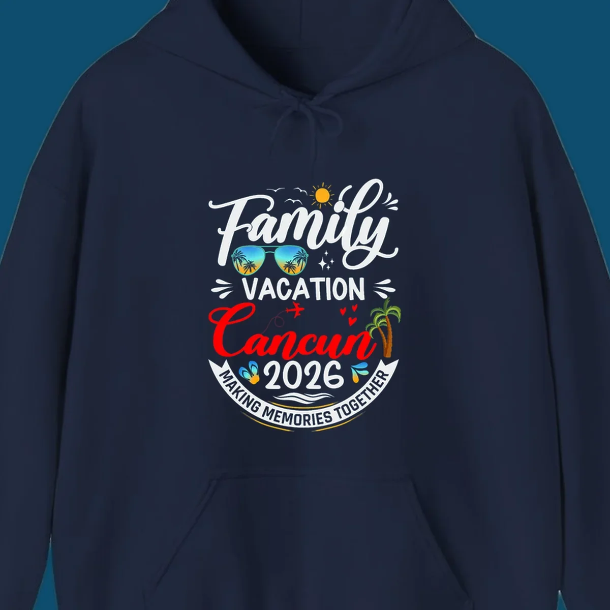 A vibrant "Family Cancun Vacation 2026" t-shirt design with a sun, birds, sunglasses, airplane, hearts, and palm trees.