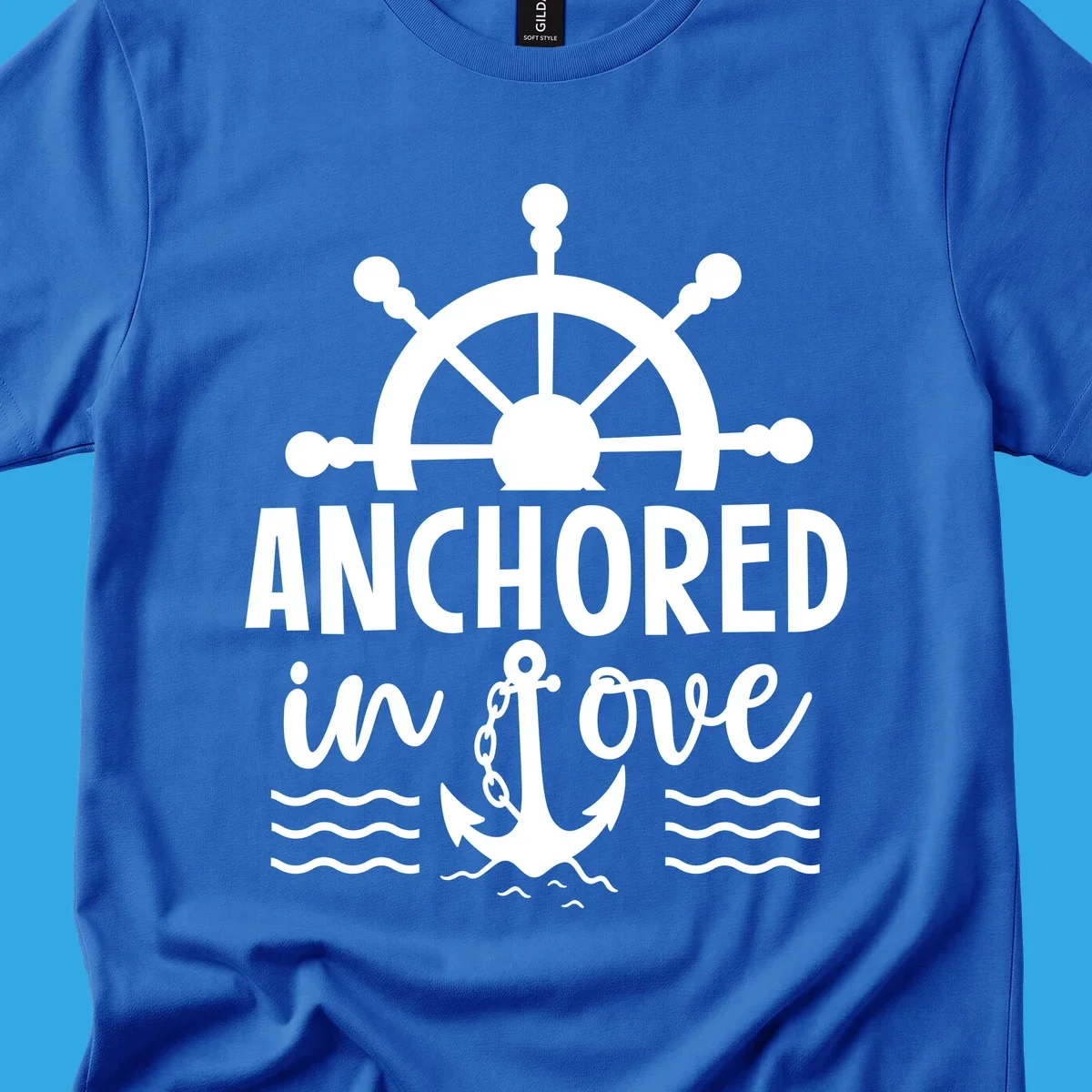 A 'Anchored in love cruise' design with a ship's wheel, the text ANCHORED in love, an anchor, and ocean waves.