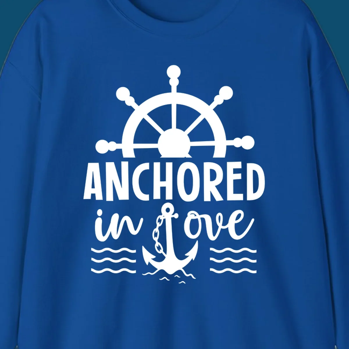 A graphic featuring a ship wheel above the text 'ANCHORED in love' with an anchor and waves below, ideal for an anchored-in-love-cruise.